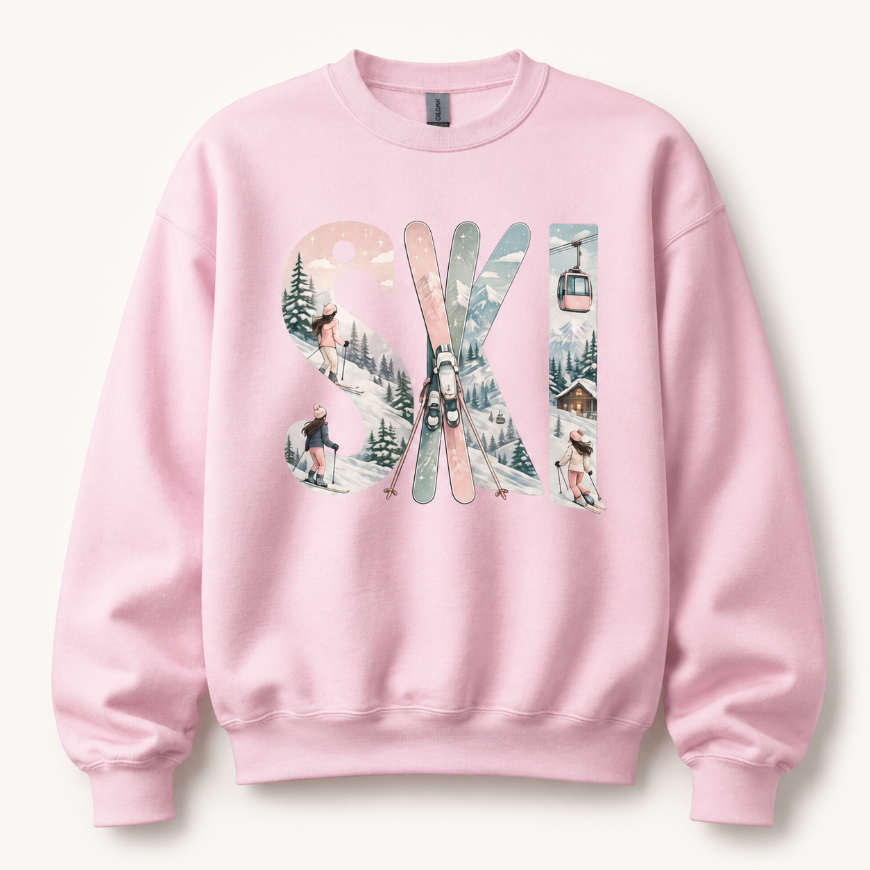 Pink sweatshirt with 'Ski' design featuring skis and a winter landscape on a white background