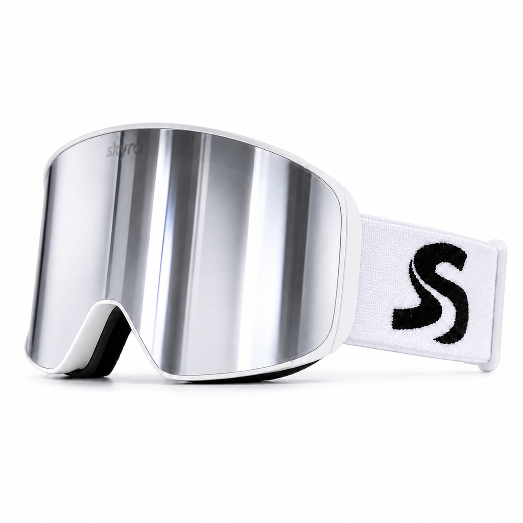 White ski snowboard goggles with silver mirror reflective lens featuring 'skyra Performance Optics' branding on a white strap.