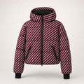 A hooded puffer ski jacket with a diagonal striped pattern in burgundy and white, featuring black zippers, black trim, and black ribbed cuffs, shown against a light beige background.