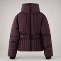 A dark plum purple puffer ski jacket with a high collar, front zipper, drawstrings, a matching pleated waist belt, and black cuffs, shown on a neutral gray background.