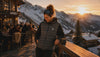 Woman wearing gilet in Apres Ski hut in the alps